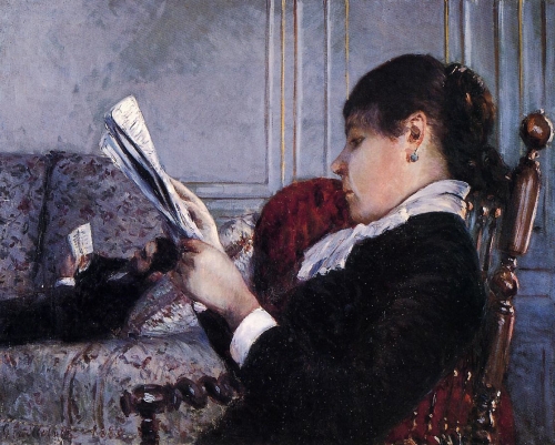 室内、読む女性